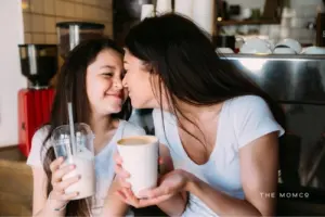 Mother and daughter out having a milkshake